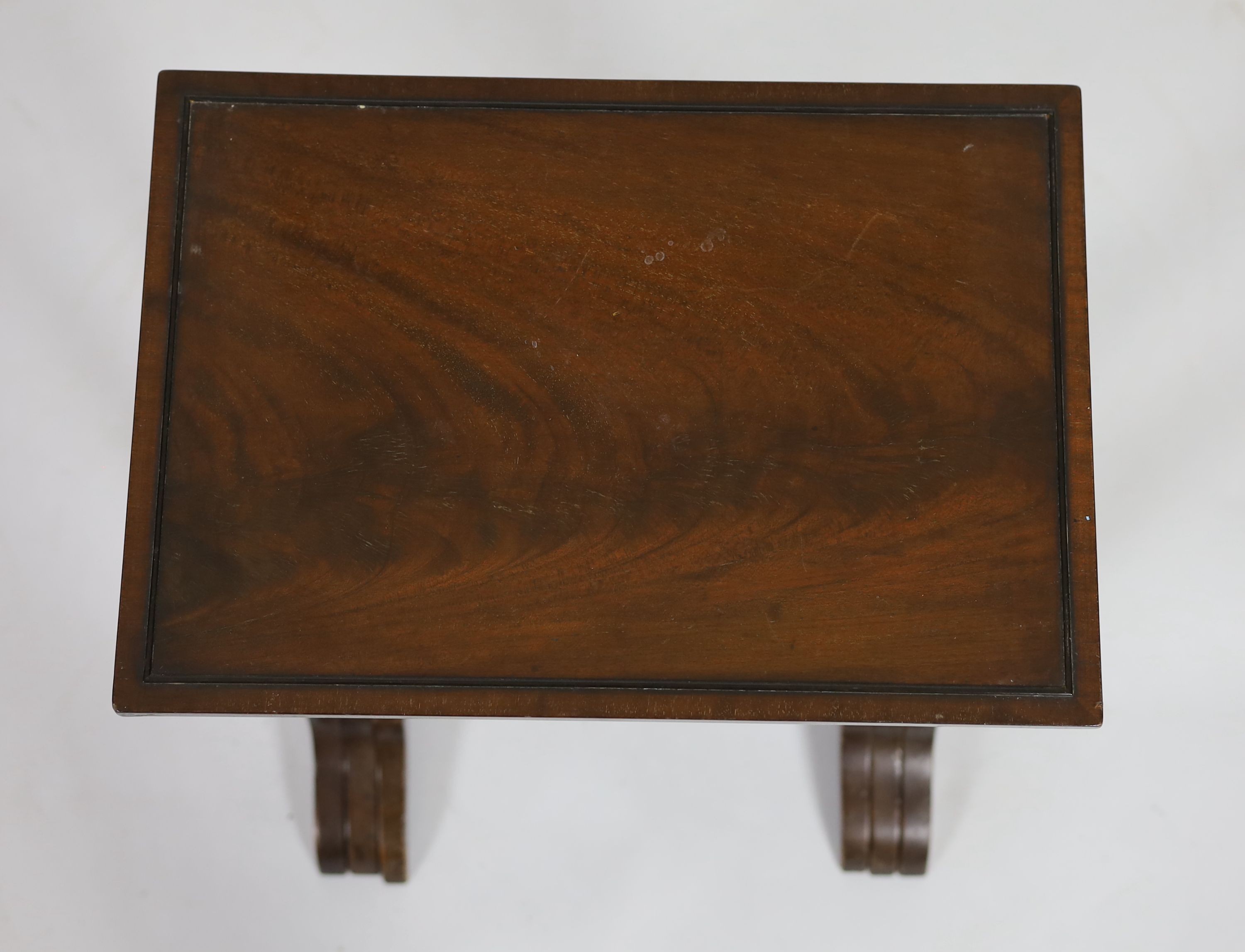 A nest of three rectangular mahogany tea tables, width 45cm depth 32cm height 67cm